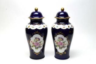 A pair of German Echt Cobalt urn vases with covers