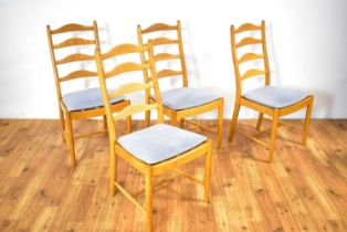 Ercol: A late 20th Century beech and elm extending dining table and four chairs