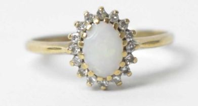 An opal and diamond cluster ring