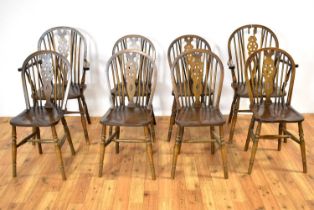 Webber of Croydon: an oak refectory-style dining table; and eight dining chairs