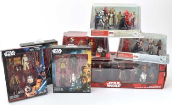 A collection of Disney Star Wars figure sets.