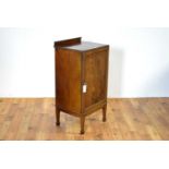 An early 20th Century mahogany music cabinet