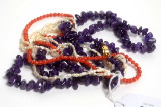 A coral and a baroque pearl necklace, and an amethyst pebble necklace