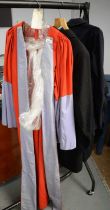 A collection of scholars robes and vintage school dress