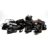 A collection of cameras and camera accessories