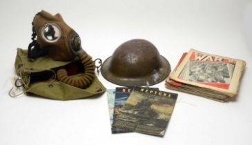 A World War II Brodie helmet and a World War II gas mask