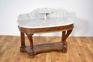 A Victorian marble-topped carved mahogany washstand