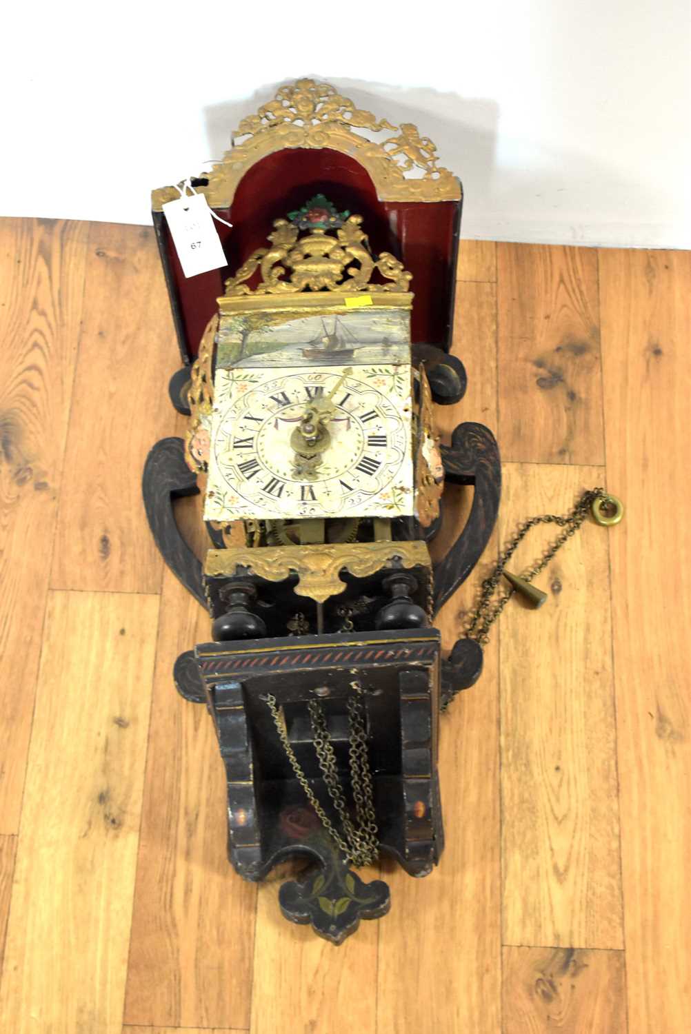 A late 19th Century Dutch 'Nu Elck Syn Sin' wall clock