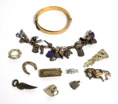 A gilt metal bangle; a selection of silver and other charms, and other jewellery