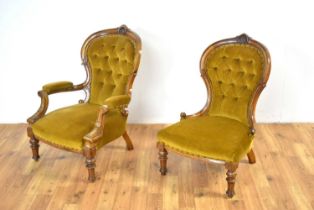 A Victorian carved walnut button-back gentlemen's easy chair and matching lady's chair