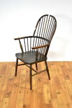 A 19th Century style beech and elm comb-back Windsor chair