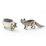 An Edwardian silver novelty pincushion and another silver example in the form of a pig