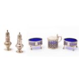 An assembled silver condiment set