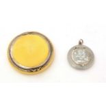 A George V silver and lemon-yellow compact and a smaller continental silver compact