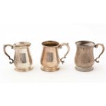 Three small silver mugs