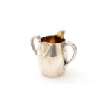A Victorian silver double-lipped cream jug