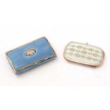 A continental silver and enamelled ladies cigarette case; and another