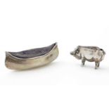 An Edwardian silver novelty pincushion; and another silver example in the form of a pig