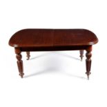 A Victorian mahogany extending dining table