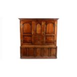 A large 18th Century oak clothes press/livery cupboard