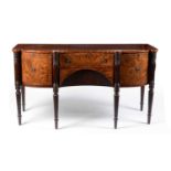 A Regency serpentine fronted mahogany and line inlaid sideboard