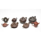 Eight Chinese Yixing stoneware teapots