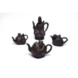 Four Chinese Yixing style teapots