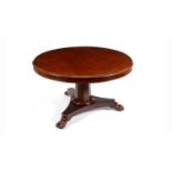 A Victorian mahogany and brass inlaid tilt-action dining table