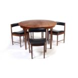 After Frem Rojle: a mid-Century teak extending dining table and chairs