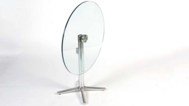 A contemporary chrome and glass tilt action table