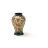 Moorcroft baluster lily pattern vase.