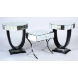 A pair of glass and ebonised wood occasional tables