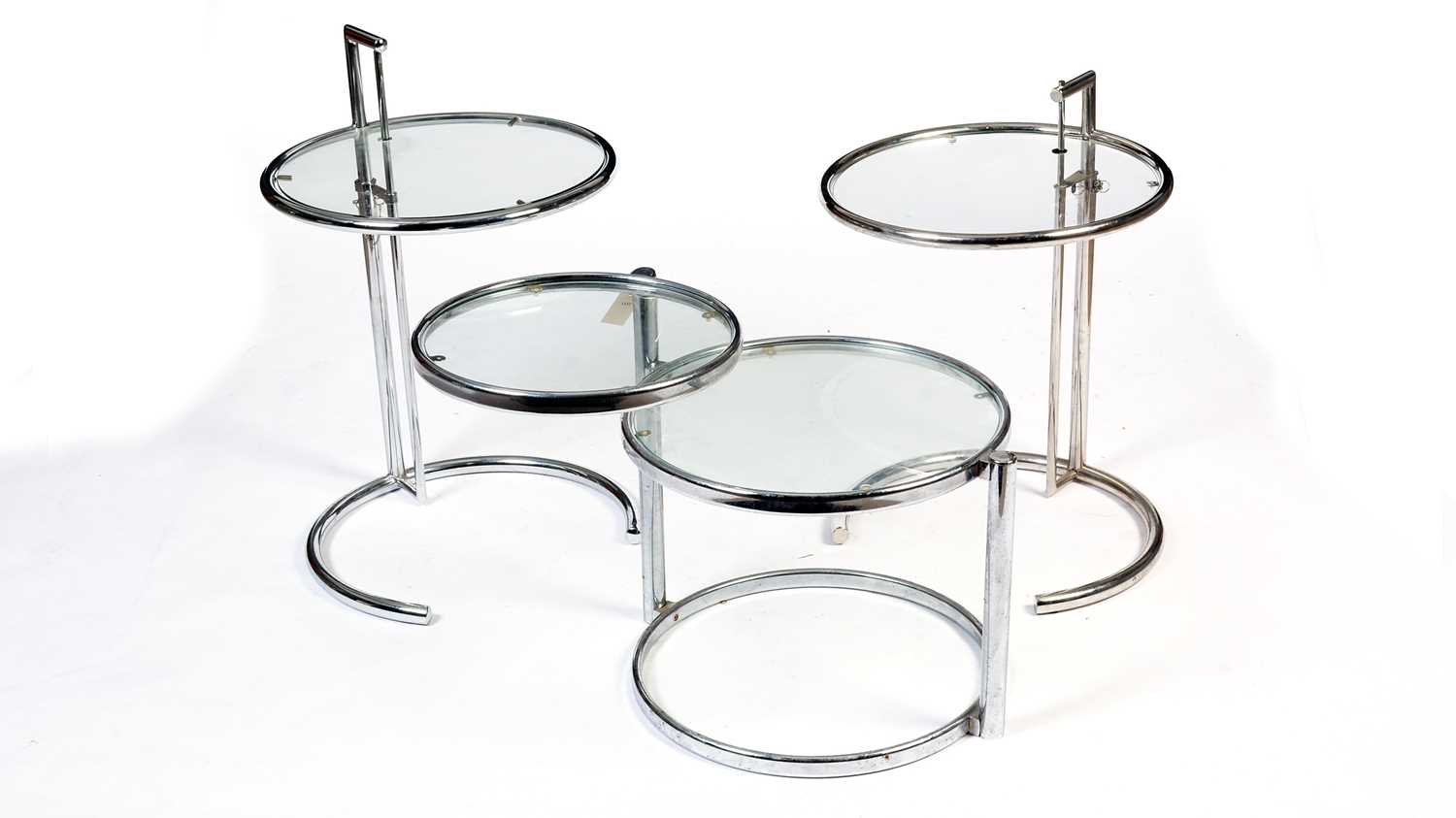 After Eileen Gray: three circular chrome and glass occasional tables