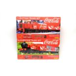 Hornby 00-gauge Coca-Cola Christmas Train Set, and Summer Train Set, both boxed.