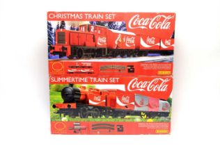 Hornby 00-gauge Coca-Cola Christmas Train Set, and Summer Train Set, both boxed.