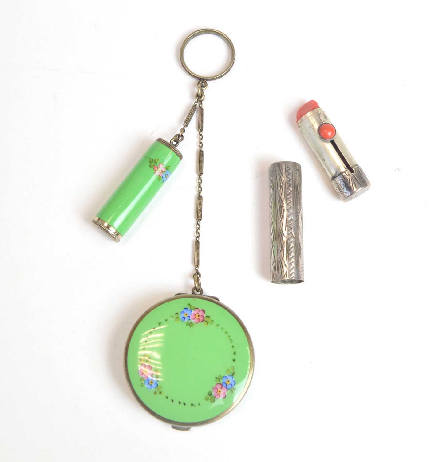 A 1920s enamelled white-metal pendant vanity duo, and lipstick case
