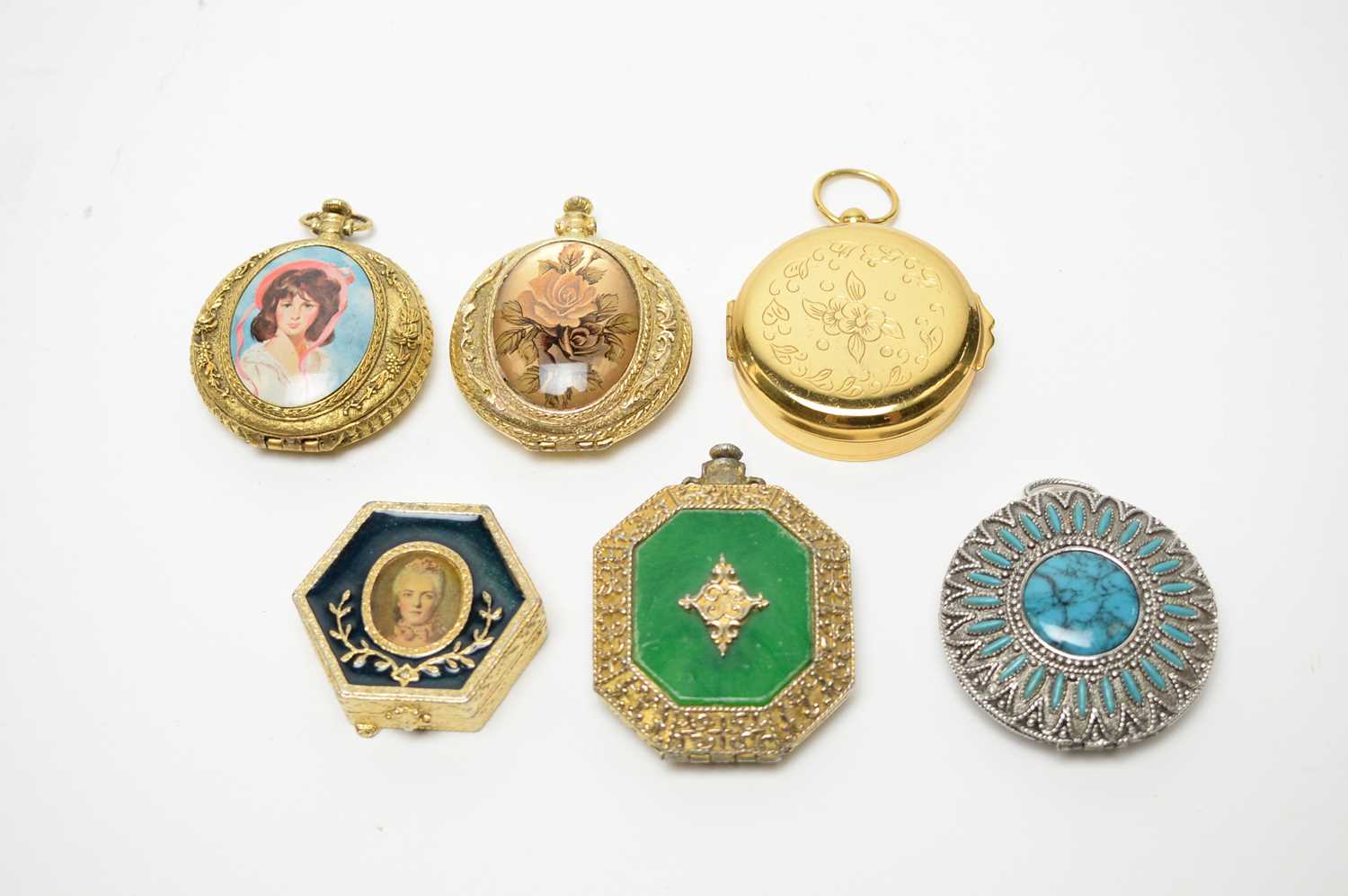 1950s pressed powder compacts in the style of pocket watches