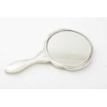 A silver mounted hand mirror