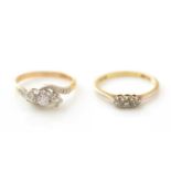Two three-stone diamond rings