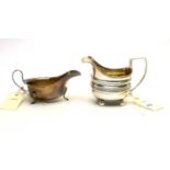 A George III silver milk jug, and a silver sauce boat
