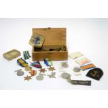 A selection of WWI and WWII medals and other items