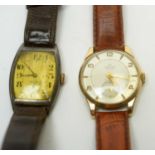 A Smiths DeLuxe 9ct gold watch, and a 1920s silver tonneau cased wristwatch.