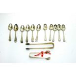 Two sets of six silver teaspoons and sugar tongs