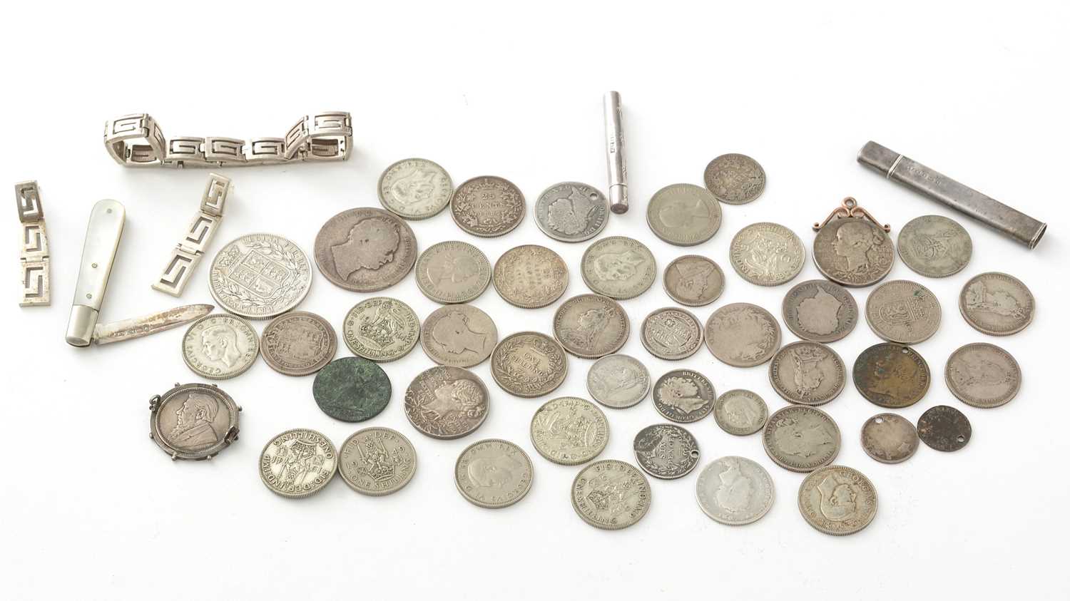 A selection of coins, and silver items