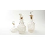 Three silver mounted cut glass decanters