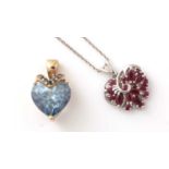 A heart shaped ruby pendant, and a blue topaz heart shaped pendant