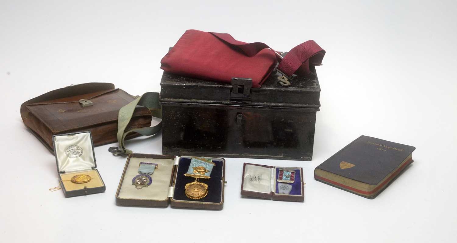A selection of Masonic regalia including gold medals