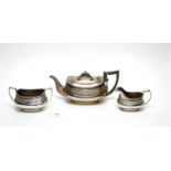 A silver three-piece tea service, by E Silver & Co
