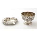 A silver embossed bowl, and a silver ashtray