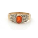 A fire opal and diamond ring